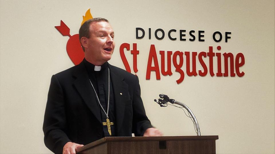 The Rev. Erik Pohlmeier, bishop-elect of the Catholic Diocese of St. Augustine, speaks to staff at his official Tuesday introduction.