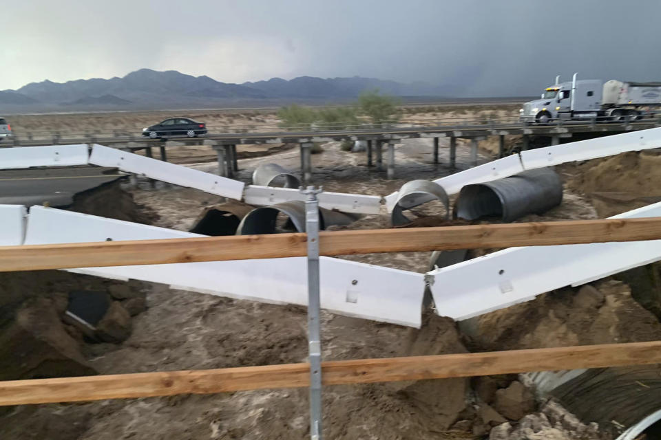 This photo provided by Caltrans shows a washed out section of Interstate 10 near Desert Center, Calif., Wednesday, Aug. 24, 2022. Eastbound traffic on Interstate 10 in the Southern California desert was blocked Thursday after flash floods washed out the roadway. The latest round of flooding caused by monsoonal thunderstorms hit Wednesday evening and also impacted other desert highways. (Caltrans via AP)