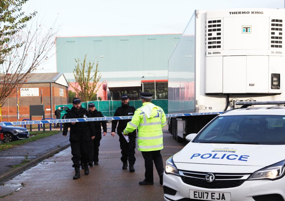 THURROCK, ENGLAND - OCTOBER 24: Police officers are seen at the scene where 39 bodies discovered in the back of a lorry on October 24, 2019 in Thurrock, England. The lorry was discovered early Wednesday morning in Waterglade Industrial Park on Eastern Avenue in the town of Grays. (Photo by Li Shanghao/China News Service/VCG via Getty Images)