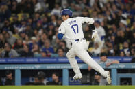 Los Angeles Dodgers designated hitter Shohei Ohtani singles during the fourth inning of a baseball game against the Miami Marlins in Los Angeles, Monday, May 6, 2024. (AP Photo/Ashley Landis)