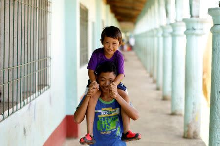 Children play at an evacuation center outside Marawi, as government forces continue their assault against insurgents from the Maute group in Marawi City, Philippines June 26, 2017. REUTERS/Jorge Silva