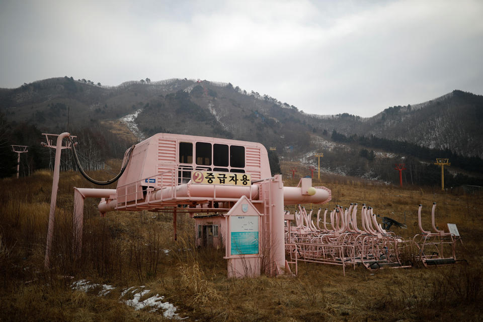 <p>Ski lift station and decommissioned ski lift chairs are seen at the abandoned Alps Ski Resort located near the demilitarized zone separating the two Koreas in Goseong, South Korea, Jan. 17, 2018. (Photo: Kim Hong-Ji/Reuters) </p>