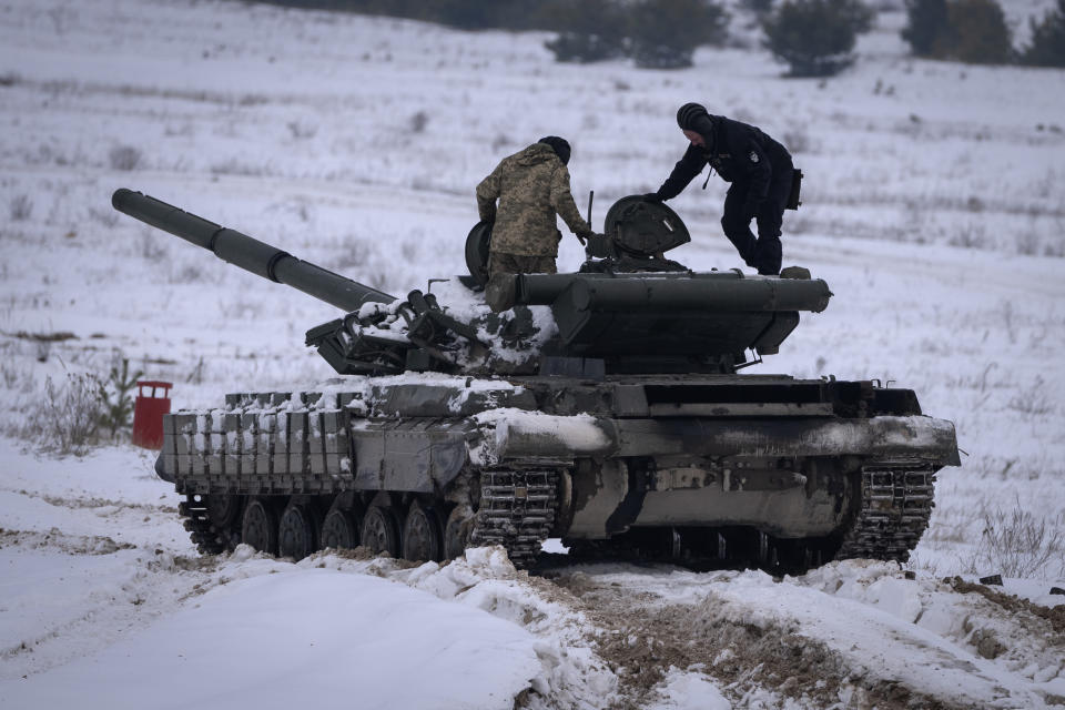 FILE - Ukrainian soldiers practice on a tank during military training at a location in Ukraine on Wednesday, Dec. 6, 2023. After blunting Ukraine's counteroffensive from the summer, Russia is building up its resources for a new stage of the war over the winter, which could involve trying to extend its gains in the east and deal significant blows to the country's vital infrastructure. Russia has ramped up its pressure on Ukrainian forces on several parts of the more than 1,000-kilometer (620-mile) front line. (AP Photo/Efrem Lukatsky, File)