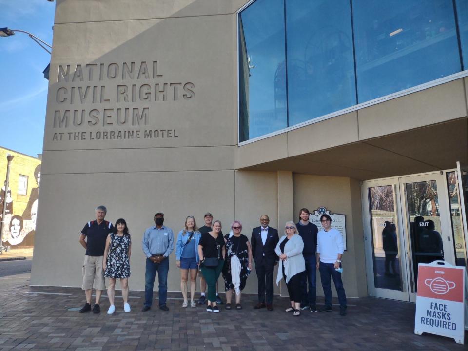 National Civil Rights Museum President Russell T. Wigginton poses with visitors at the museum one morning before opening. Wigginton has been the museum's president since August.