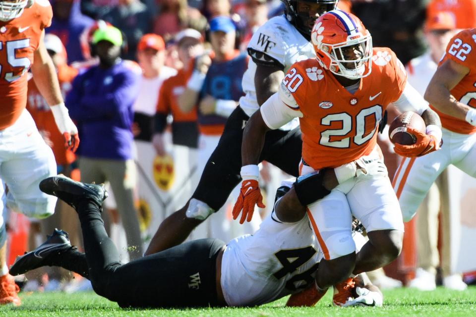 Clemson running back Kobe Pace (20) is tackled by Wake Forest linebacker DJ Taylor (46) during their game at Memorial Stadium Saturday, Nov. 20, 2021.