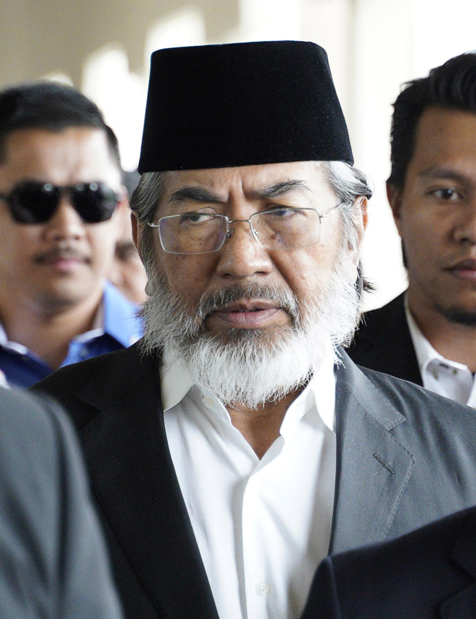 Former chief minister of Saba state on Borneo island, Musa Aman arrives at Kuala Lumpur High Court in Kuala Lumpur, Malaysia, Monday, Nov. 5, 2018. Malaysia's anti-graft agency said Monday that the former leader of a timber-rich eastern state has been arrested and will face corruption charges amid a widening crackdown on abuse by officials. (AP Photo/Yam G-Jun)