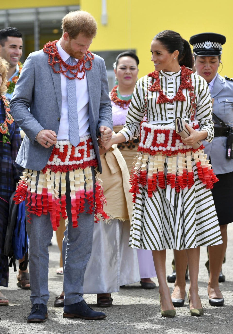 The Duke and Duchess of Sussex visit an exhibition of Tongan handicrafts, mats and tapa cloths at the Fa'onelua Convention Centre in Nuku'alofa, Tonga, Friday, Oct. 26, 2018. Prince Harry and his wife Meghan are on day 11 of their 16-day tour of Australia and the South Pacific. (Dominic Lipinski/Pool Photo via AP)