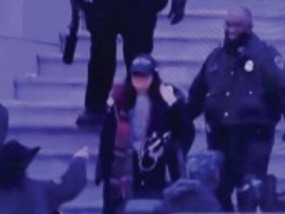 Pam Hemphill being led out of the Capitol following the riot on 6 January (Department of Justice)