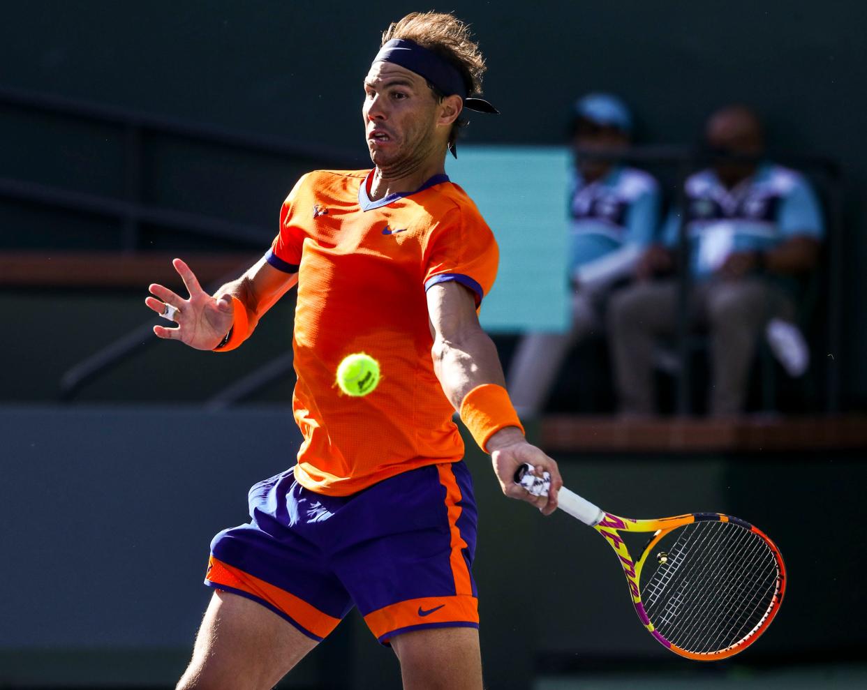 Rafael Nadal of Spain hits a shot to Taylor Fritz of the United States during the ATP singles final at the BNP Paribas Open at the Indian Wells Tennis Garden in Indian Wells, Calif., Sunday, March 20, 2022. 