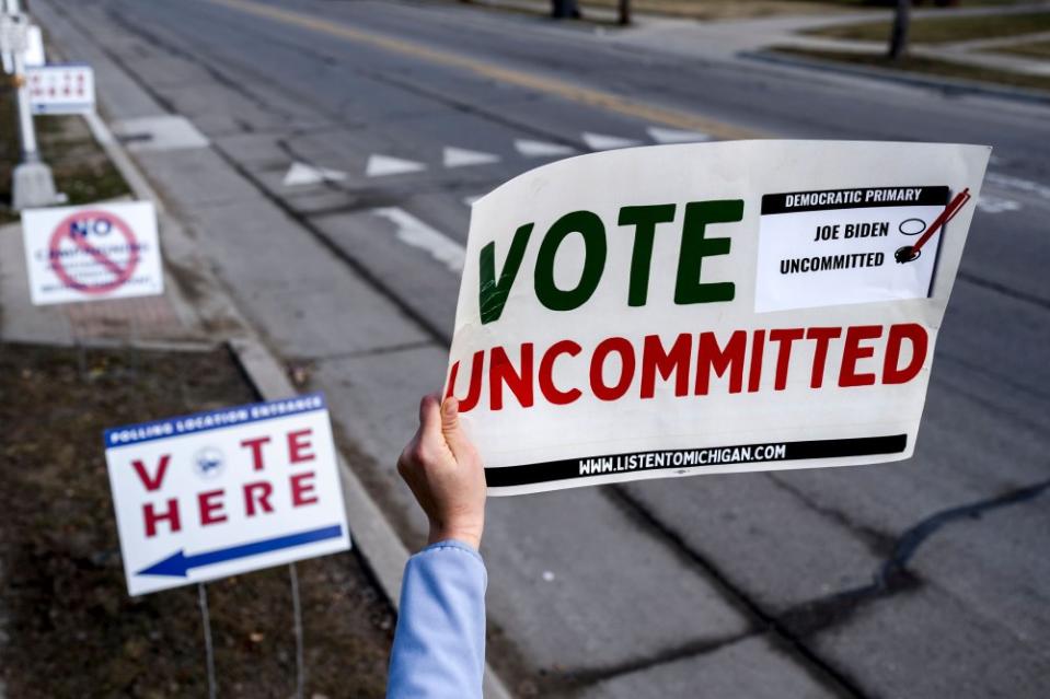 A volunteer holds a “Vote Uncommitted” sign outside of a polling station at Oakman School in Dearborn, Mich., on Feb. 27, 2024.<span class="copyright">Nic Antaya—Bloomberg/Getty Images</span>