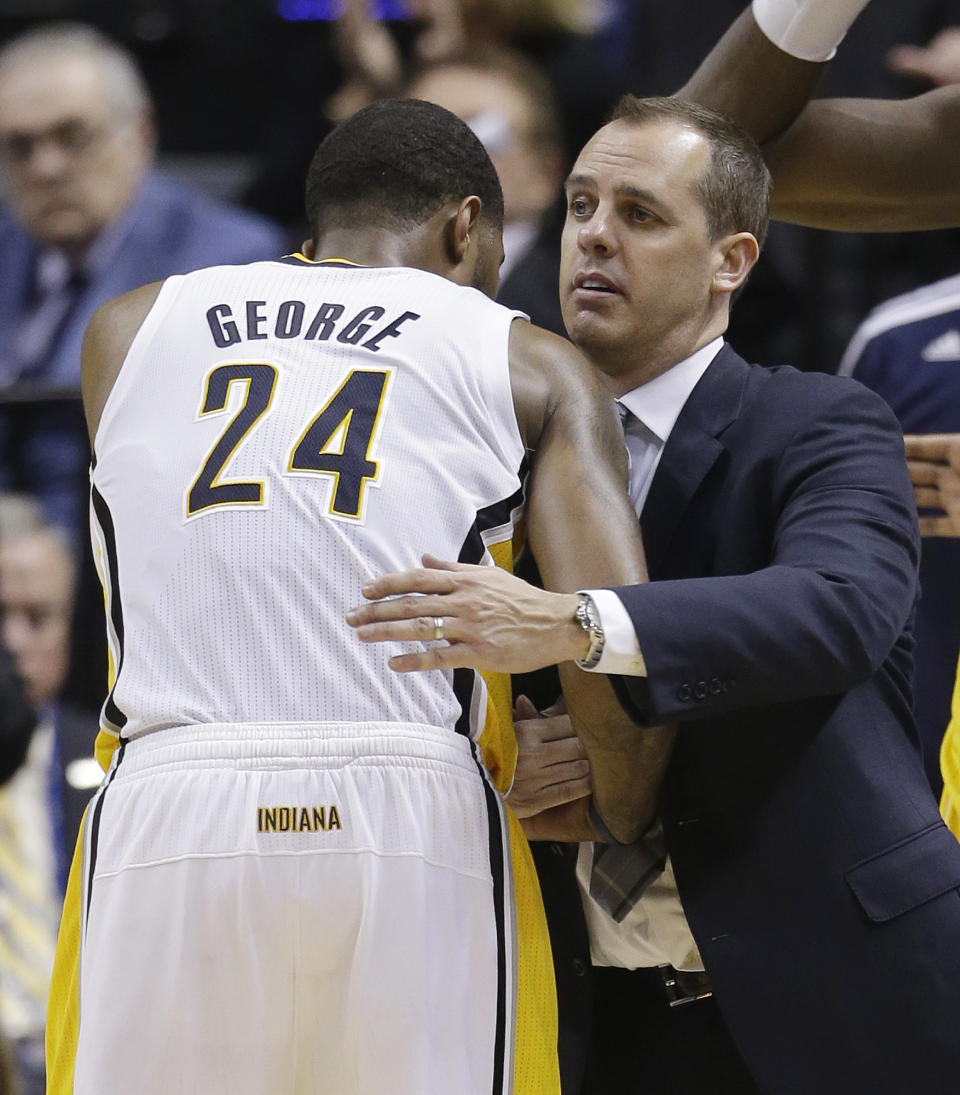 Indiana Pacers head coach Frank Vogel hugs Paul George (24) during the second half in Game 2 of an opening-round NBA basketball playoff series against the Atlanta Hawks Tuesday, April 22, 2014, in Indianapolis. Indiana defeated Atlanta 101-85. (AP Photo/Darron Cummings)