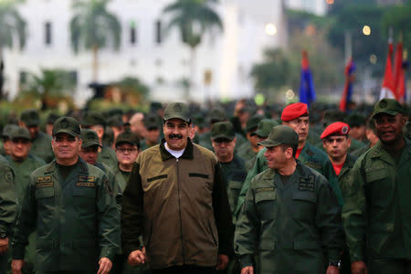 Venezuela's President Nicolas Maduro smiles as he walks next to Venezuela's Defense Minister Vladimir Padrino Lopez and Remigio Ceballos, Strategic Operational Commander of the Bolivarian National Armed Forces, during a ceremony at a military base in Caracas, Venezuela May 2, 2019. Miraflores Palace/Handout via REUTERS ATTENTION EDITORS - THIS PICTURE WAS PROVIDED BY A THIRD PARTY.