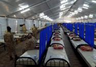 Qatari soldiers gather inside a field hopital for the coronavirus disease (COVID-19), in Ben Arous