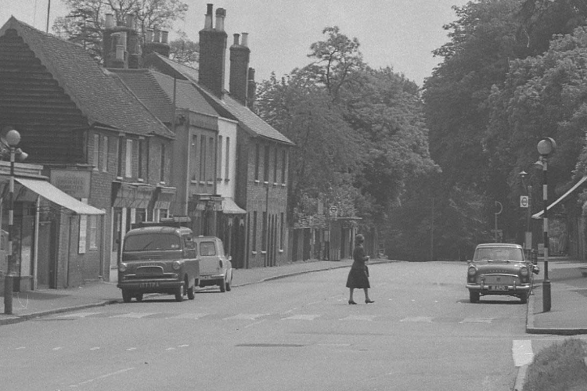 A woman crosses the road in this peaceful scene in Kings Langley from 1963 <i>(Image: Watford Observer)</i>