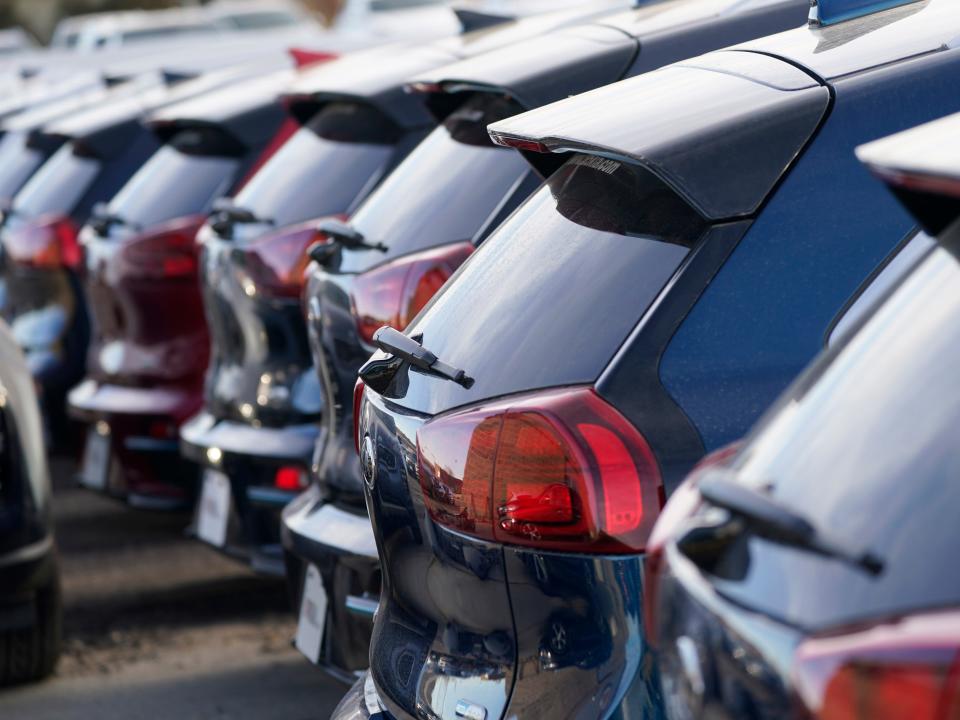 A stock image of cars in a parking lot.