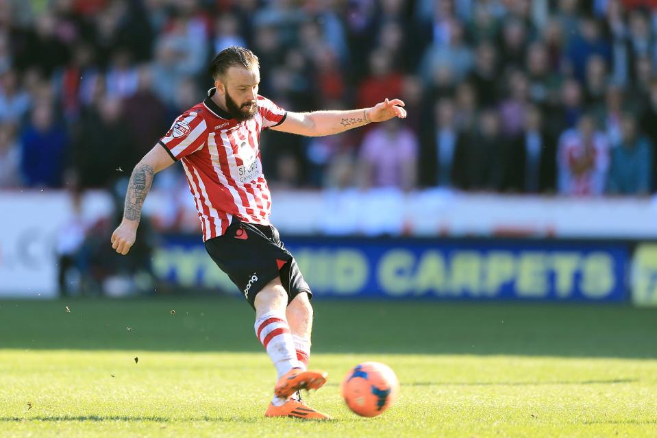 Sheffield United's John Brayford scores their second goal of the game against Charlton Athletic during their FA Cup Sixth Round match at Bramall Lane, Sheffield, Sunday March 9, 2014. (AP Photo/Nick Potts, PA) UNITED KINGDOM OUT - NO SALES - NO ARCHIVES