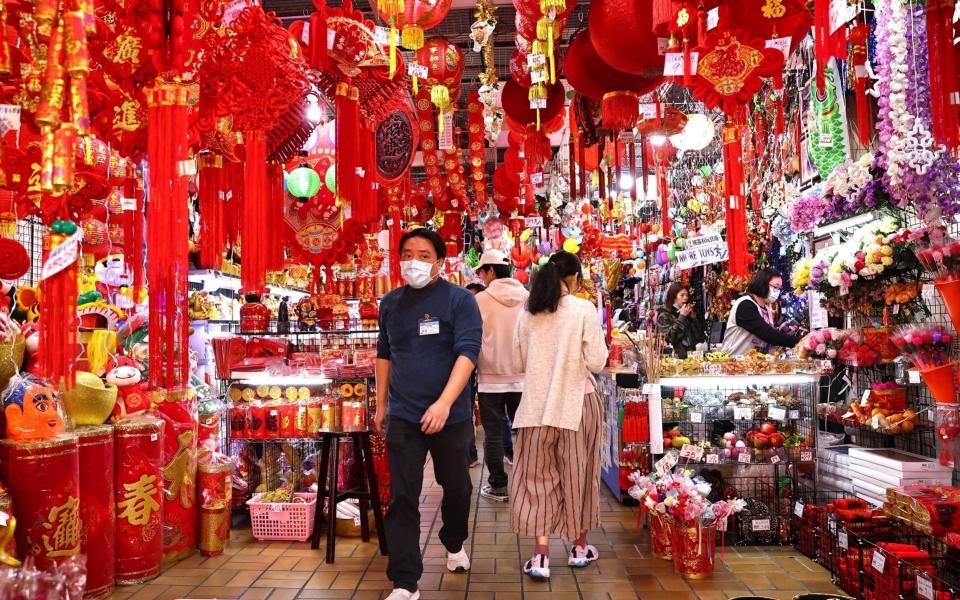 Mask-wearing shoppers in Taipei, Taiwan ahead of the Chinese New Year - Reuters