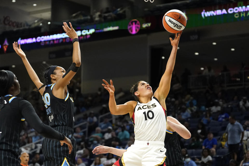 Las Vegas Aces' Kelsey Plum (10) scores past Chicago Sky's Azura Stevens during the first half of the WNBA Commissioner's Cup basketball game Tuesday, July 26, 2022, in Chicago. (AP Photo/Charles Rex Arbogast)