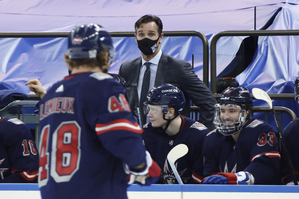 New York Rangers coach David Quinn of the New York Rangers stands behind the bench during the team's NHL hockey game against the Washington Capitals on Thursday, Feb. 4, 2021, in New York. (Bruce Bennett/Pool Photo via AP)