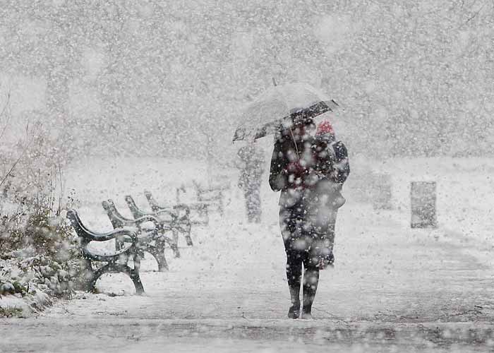 A woman in Scotland walks through a blizzard as the northern part of the UK remains in the grip of a cold snap. Met Office forecaster Dan Williams told Yahoo! News that the icy blast has been caused by a stream of cold Arctic from the north west which has swept across the northern half of the UK.