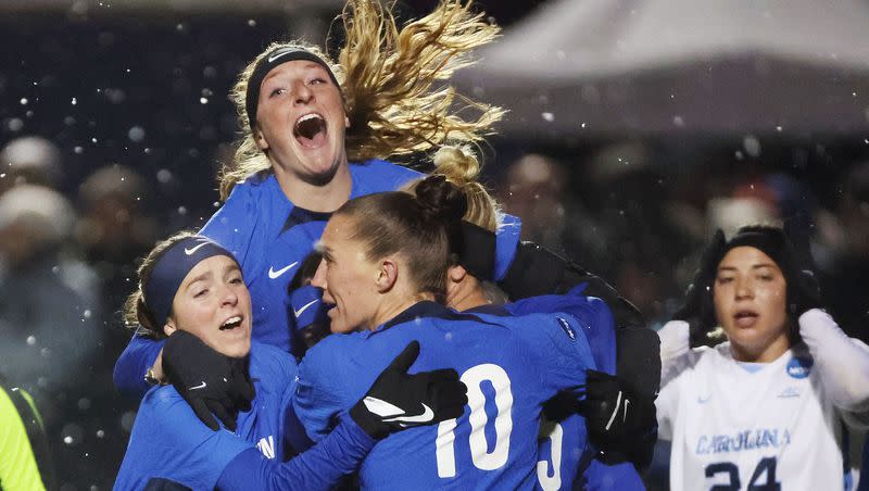 BYU midfielder Bella Folino (22) celebrates her goal against North Carolina with teammates during the NCAA Tournament quarterfinals in Provo on Nov. 24, 2023. BYU won 4-3.