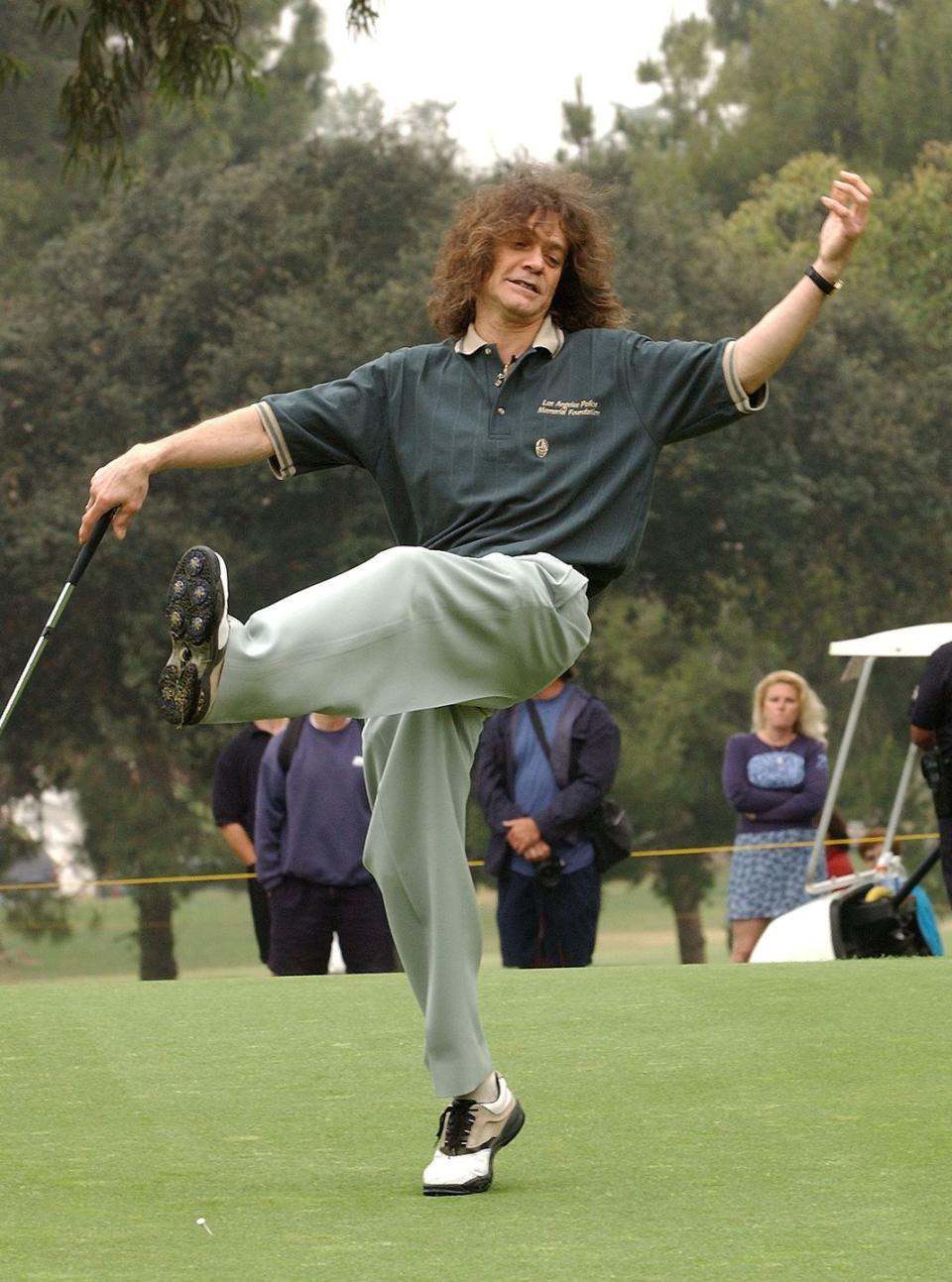 <p>Eddie Van Halen reacts to a putt during the 31st Annual Police-Celebrity Golf Tournament in 2002.</p>