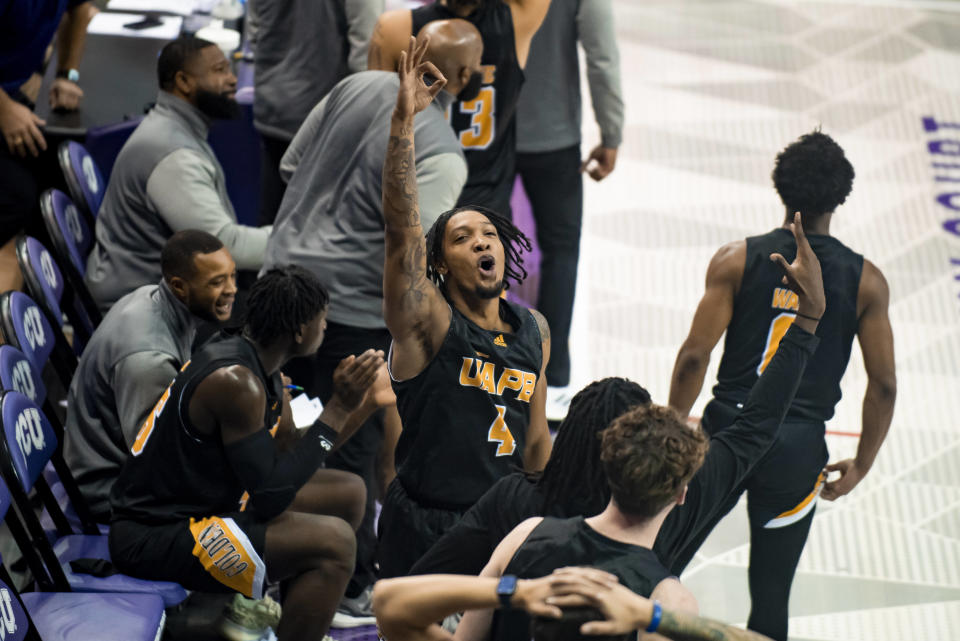 Arkansas-Pine Bluff guard Orion Virden (4) shouts after a teammate drilled a 3-point basket in the first half of an NCAA college basketball game against TCU in Fort Worth, Texas, Monday, Nov. 7, 2022. (AP Photo/Emil Lippe)