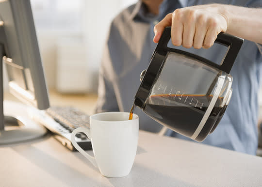 <p><b>Coffee Pot</b></p><p>If you spend your morning commute looking forward to that first cup of office-brewed joe, you may want to reconsider. <a href="https://uanews.arizona.edu/story/germs-spread-fast-at-work-study-finds" rel="nofollow noopener" target="_blank" data-ylk="slk:University of Arizona research;elm:context_link;itc:0;sec:content-canvas" class="link ">University of Arizona research</a> found coffee pot handles in the break room to be one of the germiest areas in the office. It only took four hours for cold, flu and stomach viruses to spread from one infected person to a few germ “hot spots,” including the coffee maker. Your best defense? Hand washing and antibacterial wipes.</p>