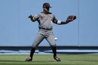 Mar 28, 2019; Los Angeles, CA, USA; Arizona Diamondbacks center fielder Ketel Marte (4) mishandles a ball hit by Los Angeles Dodgers right fielder Cody Bellinger (not pictured) during the fourth inning at Dodger Stadium. Mandatory Credit: Kelvin Kuo-USA TODAY Sports