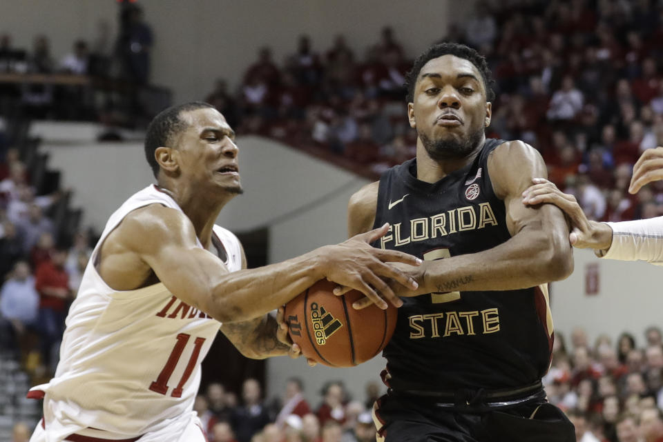 Florida State's Trent Forrest (3) is defended by Indiana's Devonte Green (11) during the second half of an NCAA college basketball game Tuesday, Dec. 3, 2019, in Bloomington, Ind. Indiana won 80-64. (AP Photo/Darron Cummings)