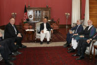 Secretary of State Mike Pompeo, left, meets with Afghan President Ashraf Ghani, Afghan Chief Executive Officer Abdullah Abdullah, and former Afghan President Hamid Karzai, right, at the Presidential Palace in Kabul, Afghanistan, Tuesday, June 25, 2019, during an unannounced stop. (AP Photo/Jacquelyn Martin, Pool)