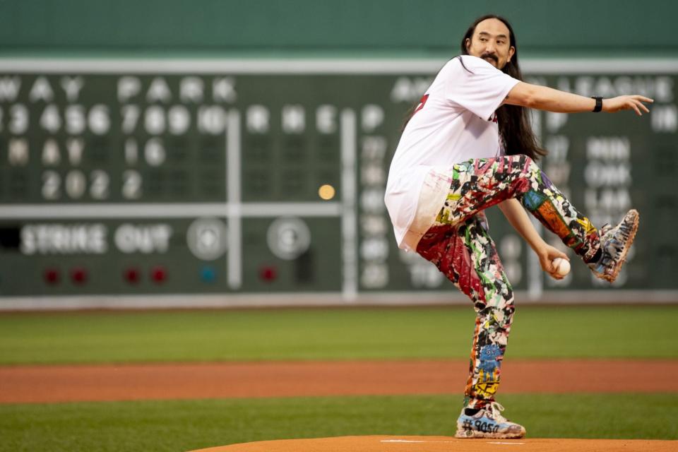 BOSTON, MA - MAY 16: DJ Steve Aoki throws out a ceremonial first pitch before a game between the Boston Red Sox and the Houston Astros on May 16, 2022 at Fenway Park in Boston, Massachusetts. (Photo by Billie Weiss/Boston Red Sox/Getty Images)