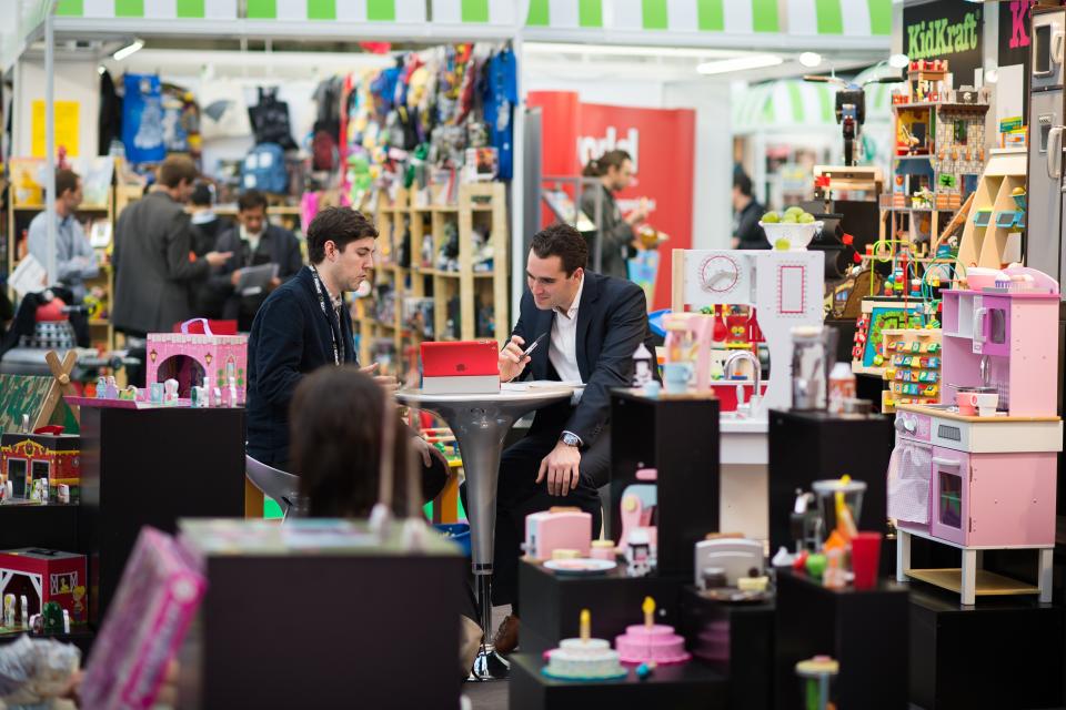 Trade representatives speak during the Toy Fair 2015 in central London on January 20, 2015. Toy Fair, the only dedicated toy, game and hobby exhibition in Britain, features over 260 companies competing for business. AFP PHOTO / LEON NEAL        (Photo credit should read LEON NEAL/AFP/Getty Images)