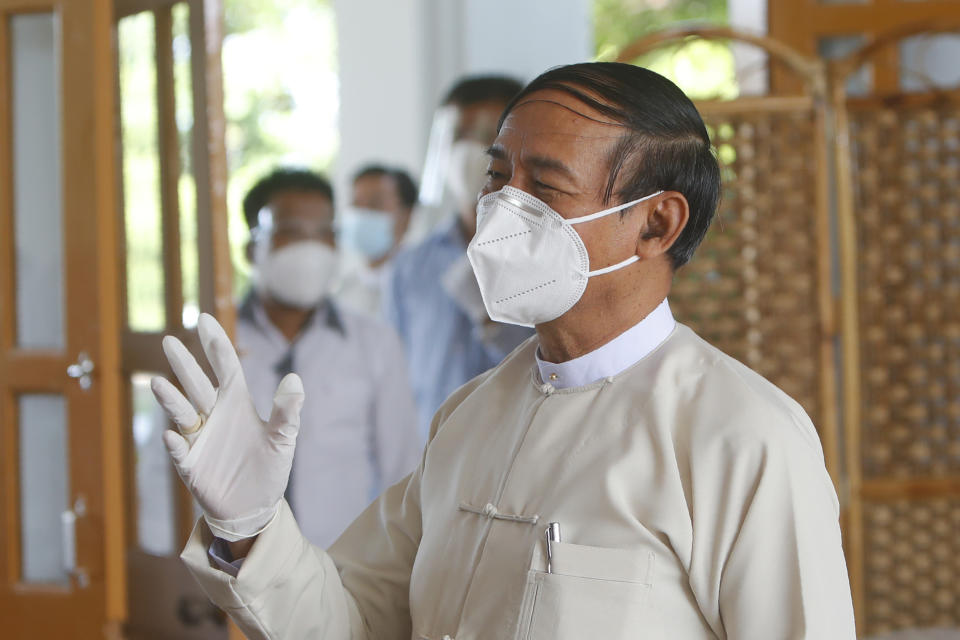 Myanmar President Win Myint talks to journalists at Union Election Commission office after he cast his advanced ballot for upcoming Nov. 8 general election, in Naypyitaw, Myanmar Thursday, Oct. 29, 2020. (AP Photo/Aung Shine Oo)