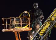 <p>A statue of Confederate general P.G.T. Beauregard is prepared for removal, Tuesday, May 16, 2017, from the entrance to City Park in New Orleans. The city council voted to remove the monument and three other Confederate and white supremacist monuments in Dec. 2015. (Photo: Scott Threlkeld/AP) </p>