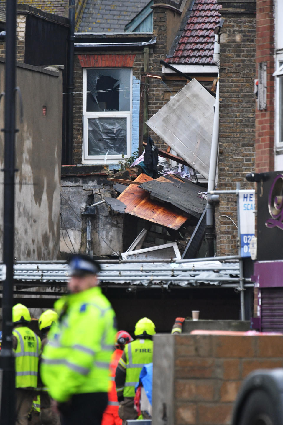 Emergency services at the scene of a suspected gas explosion on King Street in Ealing, west London. Rescuers are involved in a "complex" search for anyone who may still be inside the collapsed building.
