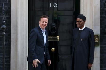 Nigeria's President-elect Muhammadu Buhari (R) departs after meeting with Britain's Prime Minister David Cameron at Downing Street in London, England, May 23, 2015. REUTERS/Neil Hall