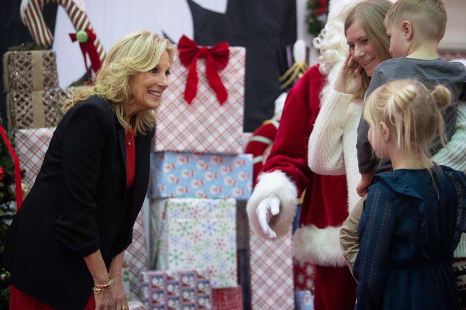Ft. Campbell families impacted by EF-3 tornadoes have their photo taken with First Lady Dr. Jill Biden and Santa at Ft. Campbell in Kentucky., Saturday, Dec. 23, 2023