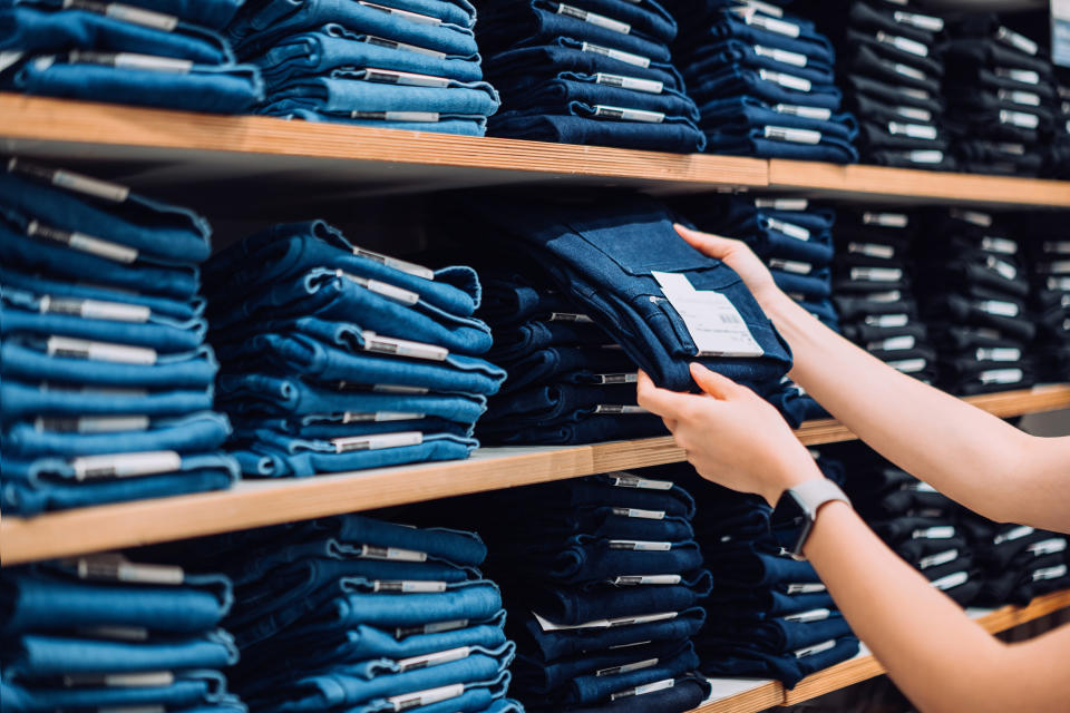 folded jeans on a shelf