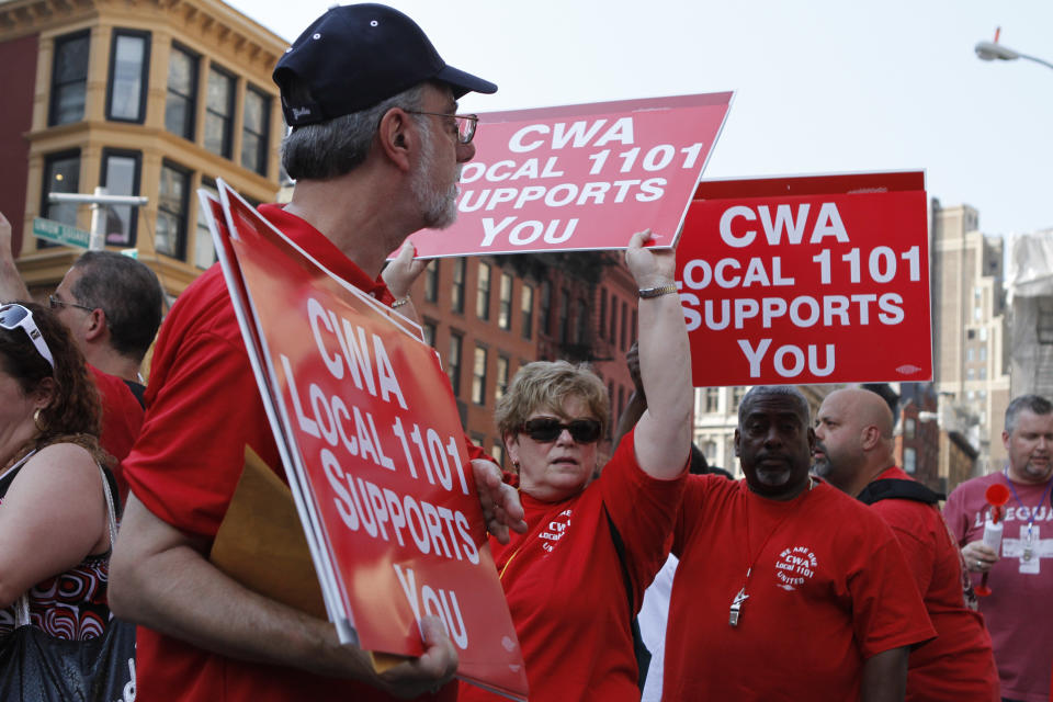 Members of the Utility Workers Union of America Local 1-2 rally during a march and rally at Union Square, Tuesday, July 17, 2012 in New York. The Consolidated Ed workers were locked out on June 30 after their contract expired and negotiations over a new one failed. About 5,000 managers are keeping electricity going for 3.2 million customers in New York City and Westchester County. (AP Photo/Fay Abuelgasim)