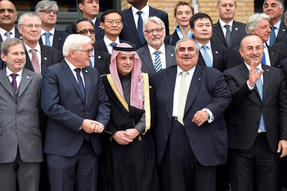 (First row From L) European Union Commissioner Johannes Hahn, German Foreign Minister Frank-Walter Steinmeier, Saudi Arabia's Foreign Minister Adel al-Jubeir, Bahraini Foreign Minister Khalid bin Ahmed al-Khalifa, and Turkish Foreign Minister Mevlut Cavusoglu pose for a group photo during a Mideast peace conference in Paris, Sunday, Jan. 15, 2017. Fearing a new eruption of violence in the Middle East, more than 70 world diplomats gathered in Paris on Sunday to push for renewed peace talks that would lead to a Palestinian state. (Bertrand Guay/Pool Photo via AP)