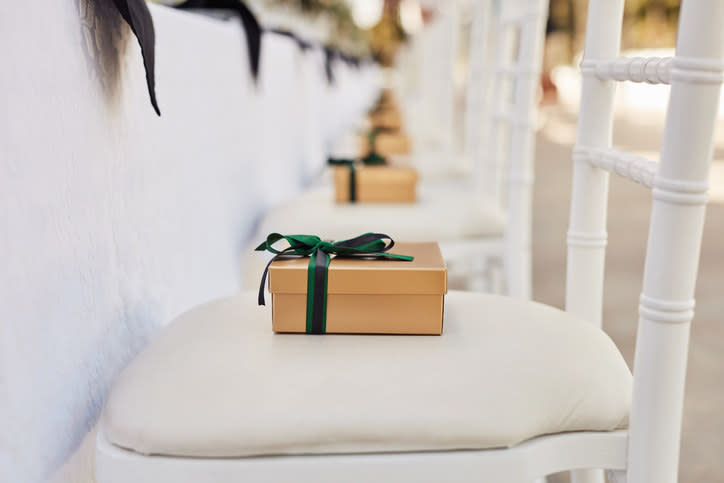 Party favors sitting on a row of empty chairs.