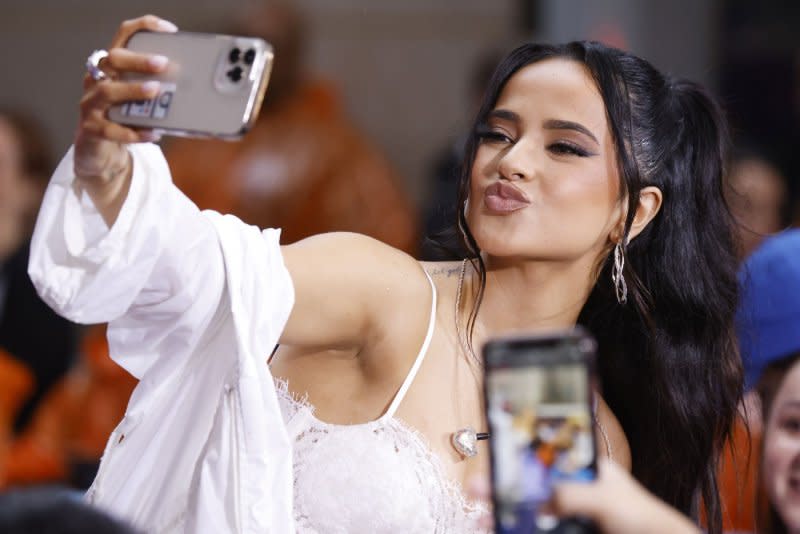 Becky G takes a selfie with fans. Photo by John Angelillo/UPI