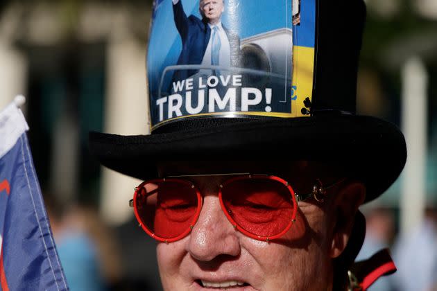 Gregg Donovan waits outside the Miami courthouse, wearing a hat that reads 