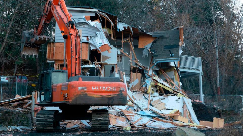 PHOTO: Heavy equipment is used to demolish the house where four University of Idaho students were killed in 2022 on Dec. 28, 2023, in Moscow, Idaho. (Ted S. Warren/AP)