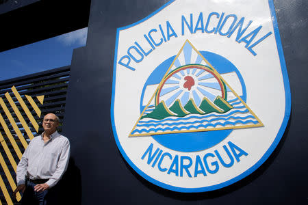 Journalist Carlos Fernando Chamorro, critic of the government of President Daniel Ortega stands in front of the main entrance of police headquarters in Managua, Nicaragua December 15, 2018.REUTERS/Oswaldo Rivas