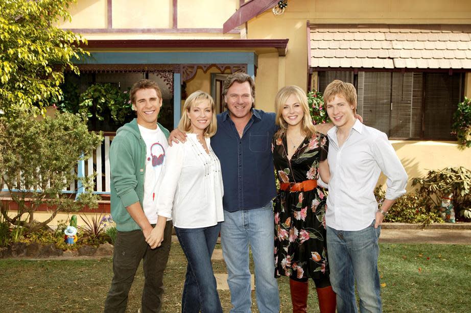 A photo of Packed To The Rafters cast members Rebecca Gibney (Julie Rafter), Erik Thomson (Dave Rafter), Jessica Marais (Rachel Rafter), Hugh Sheridan (Ben Rafter), Angus McLaren (Nathan Rafter)