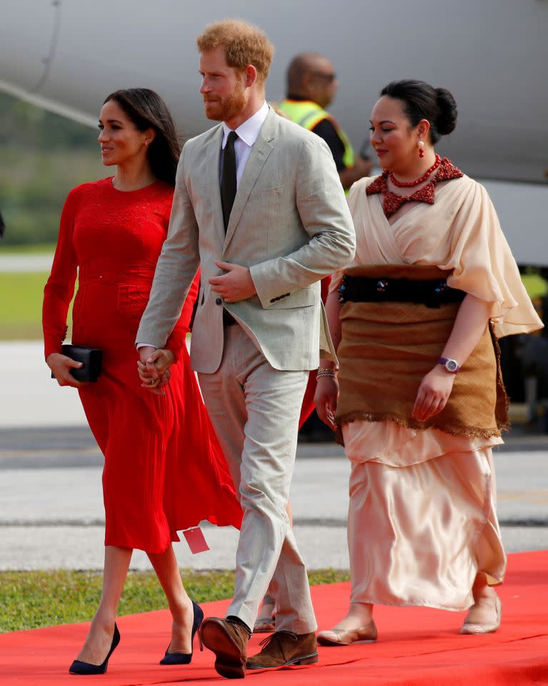 A tag was still showing on Meghan’s dress when she arrived in Tonga. (Photo: Reuters)