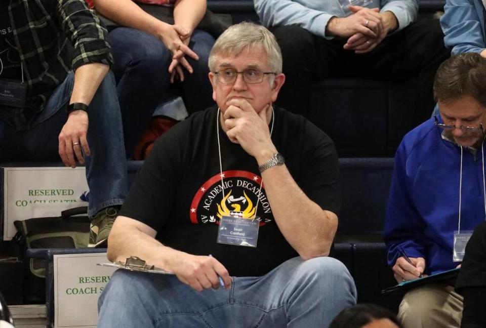 University High coach Sean Canfield watches the Super Quiz portion of the 2023 Fresno County Academic Decathlon from the Sunnyside High bleachers.