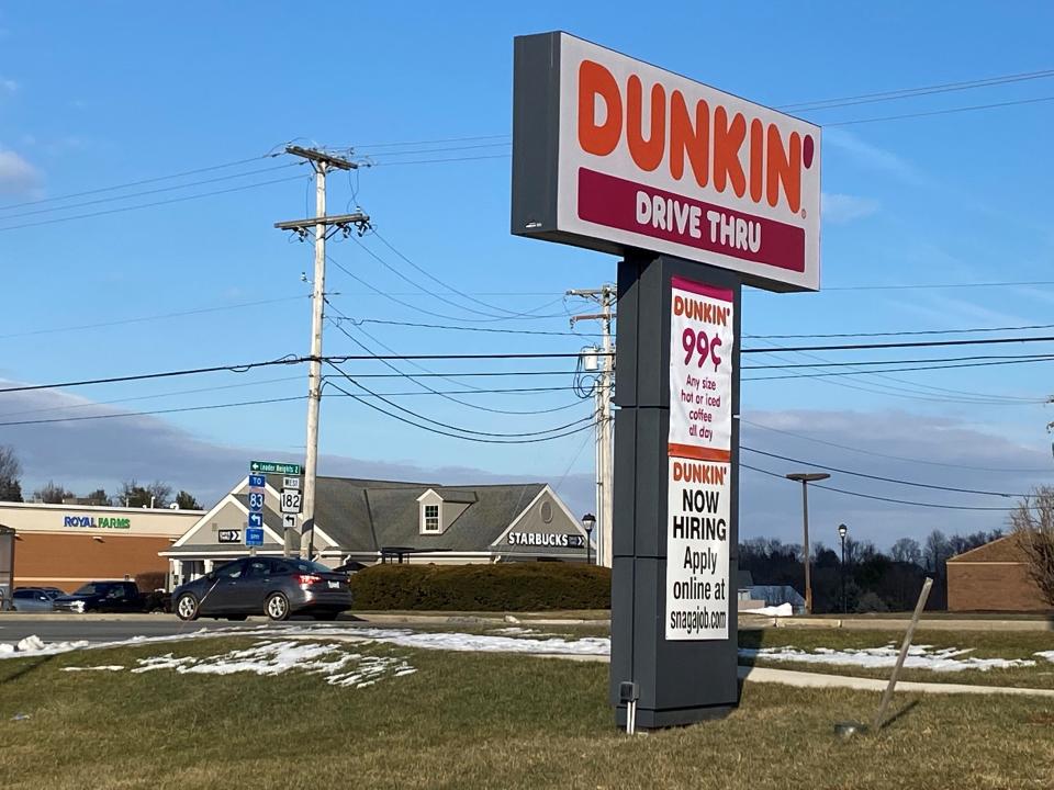 In the past two years, national coffee shops – Dunkin’ and Starbucks – have moved into former bank buildings in this stretch of the York Township village of Spry. Coffee now is handed out through their former drive-thru windows.